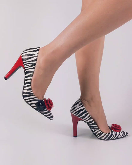 Pumps zebra body with red flower accent on top and red heel. High heel shoes. 