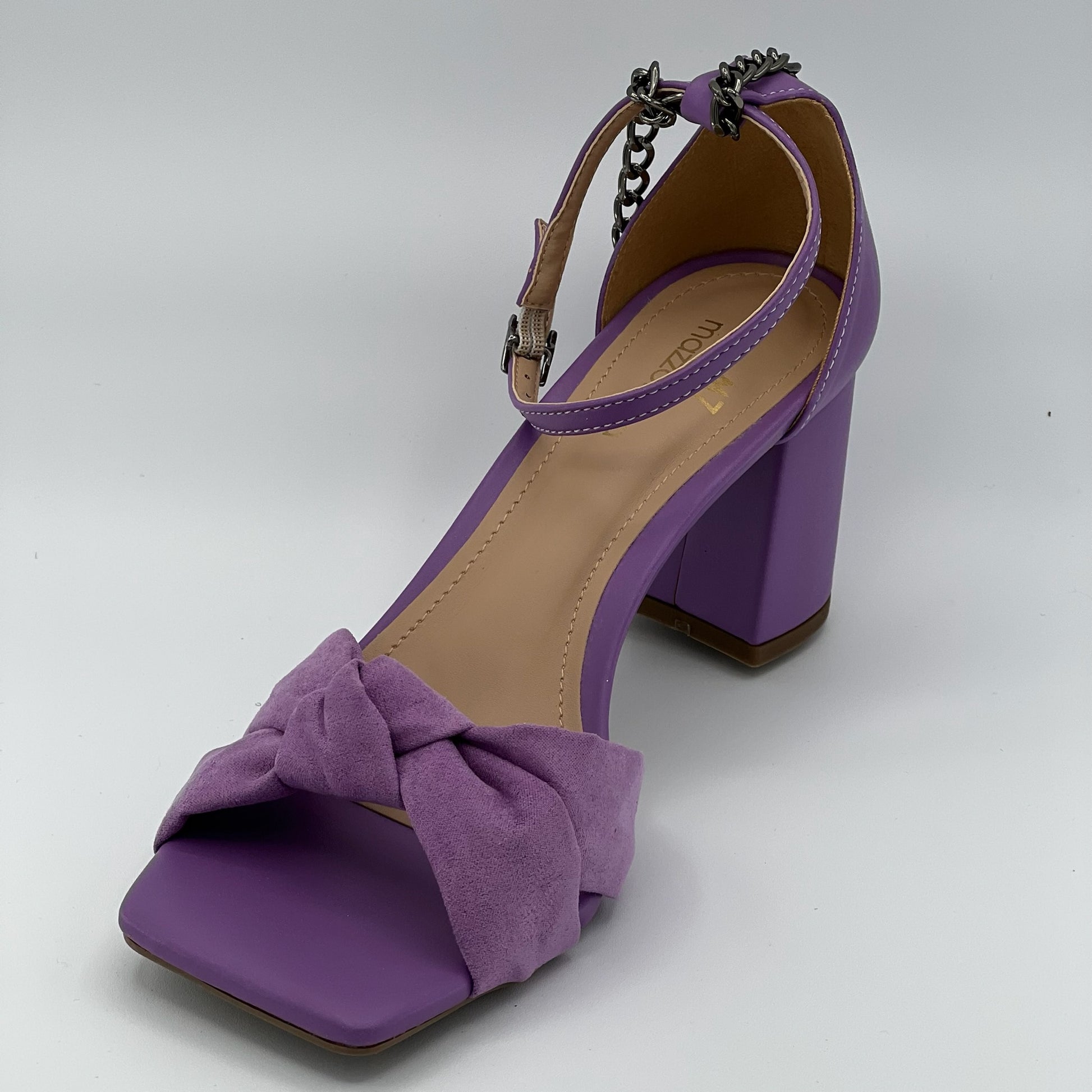 Light purple lavender sandals with chain accent, block hill, closure in the back.