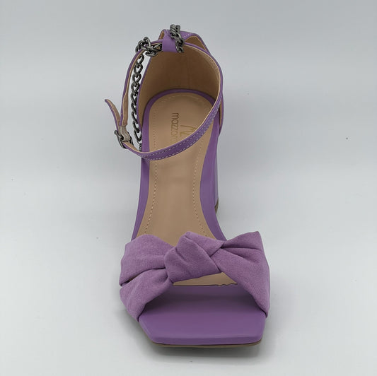 Light purple lavender sandals with chain accent, block hill, closure in the back.
