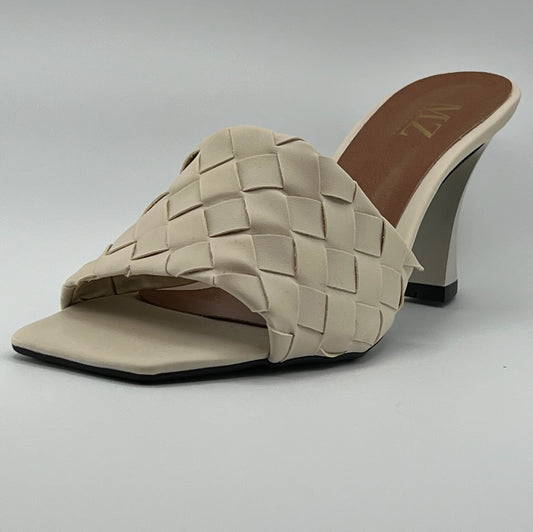 Side view women shoe mule in cream color
